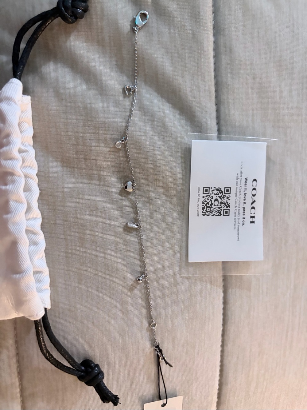Coach Silver-tone Heart and Crystal Charm Bracelet